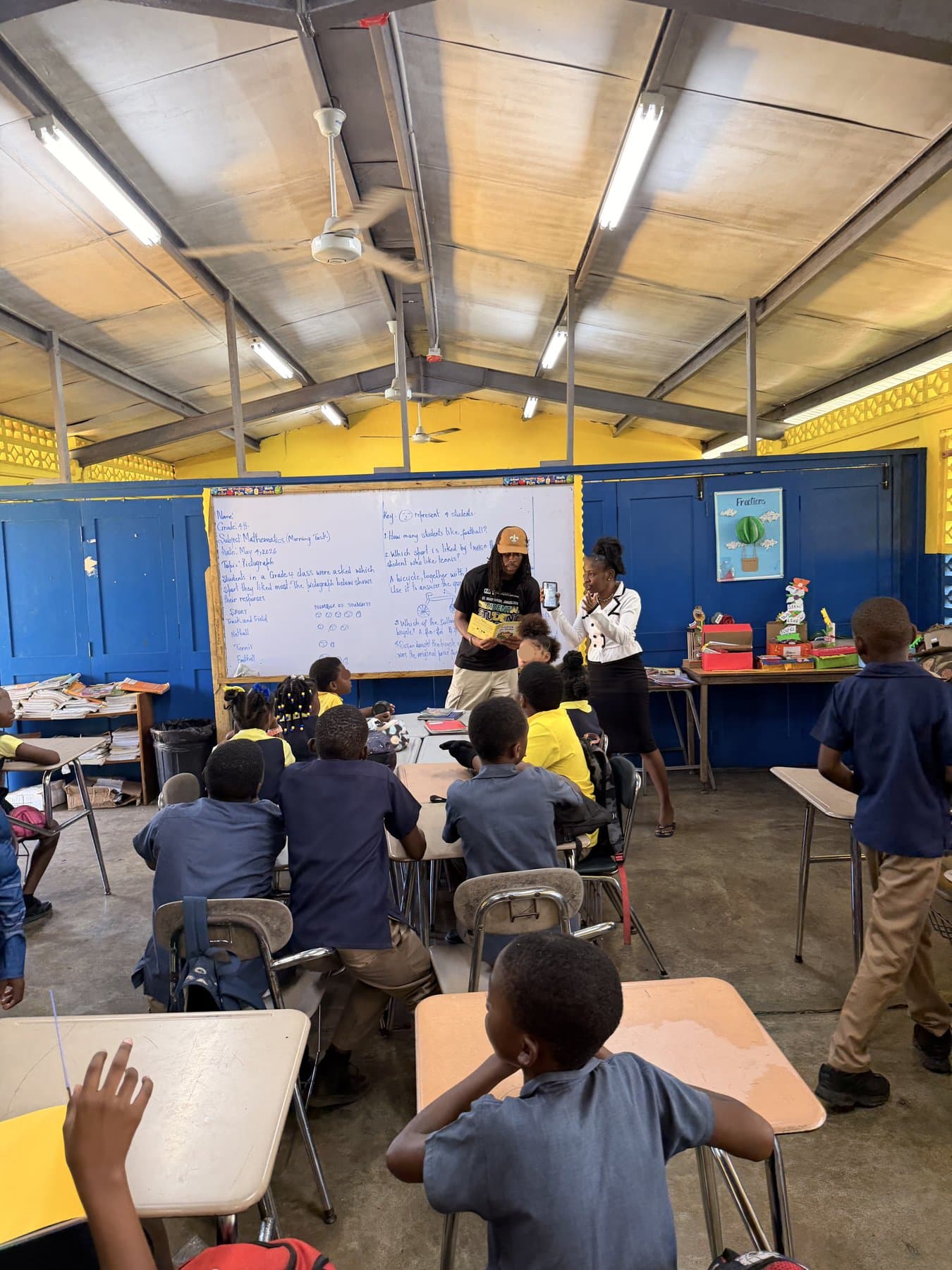 Kameron leading a classroom session with students